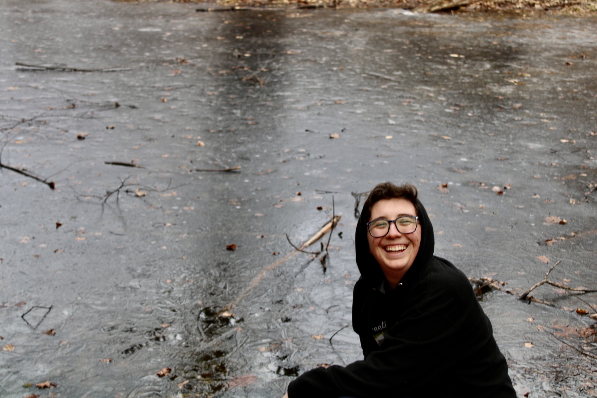Photo: Micah Rensunberg by a frozen pond at the Woolman Hill Retreat Center.